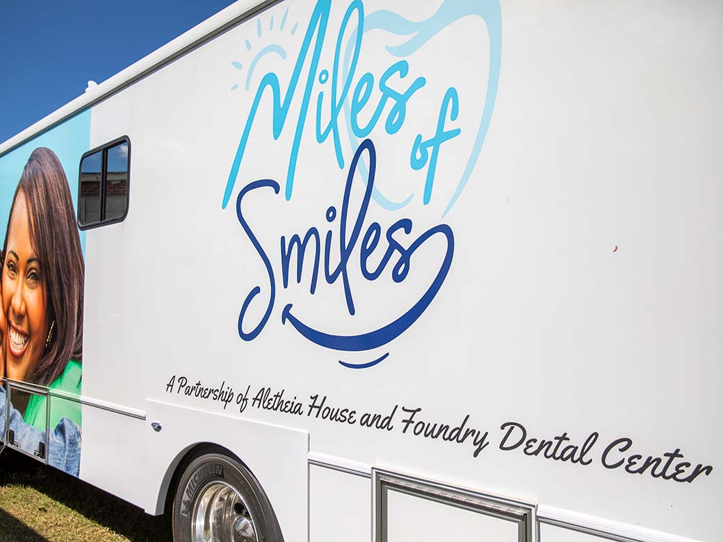 milesofsmiles-logo-on-bus